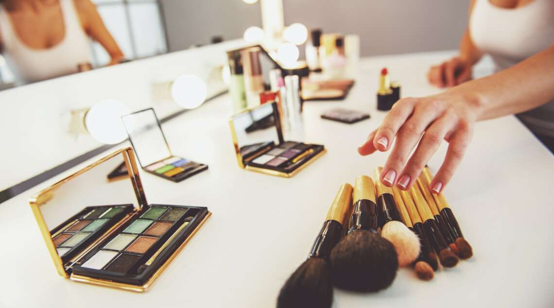 Beautiful girl doing makeup