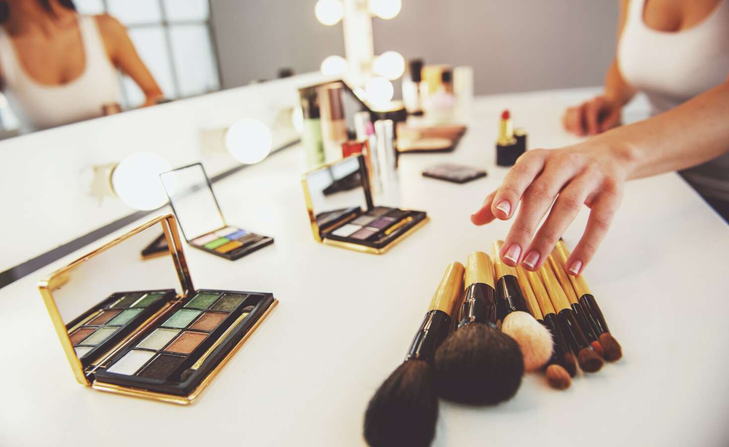 Beautiful girl doing makeup