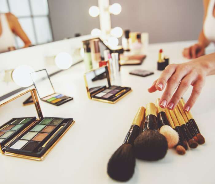 Beautiful girl doing makeup