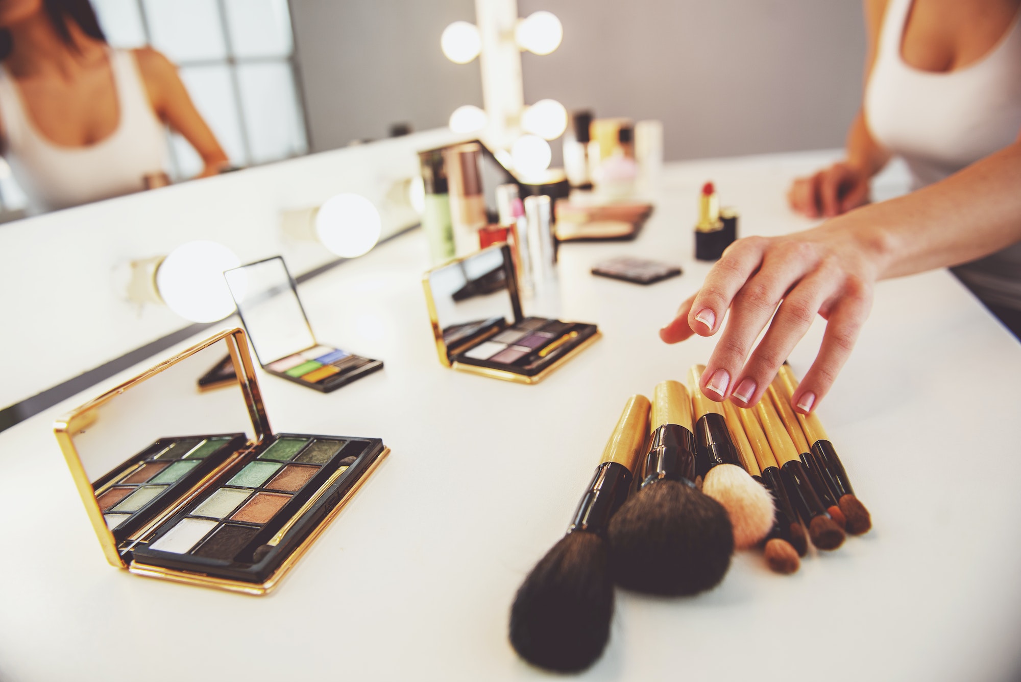 Beautiful girl doing makeup