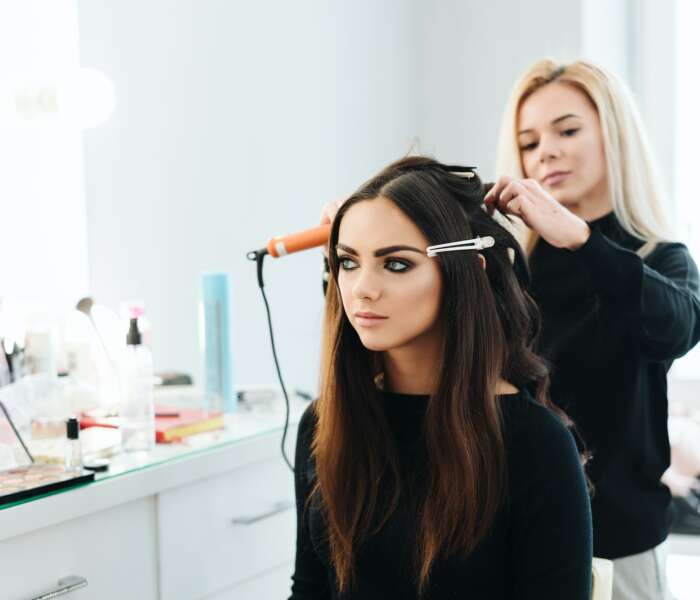 Makeup and hairstyle for a beautiful model